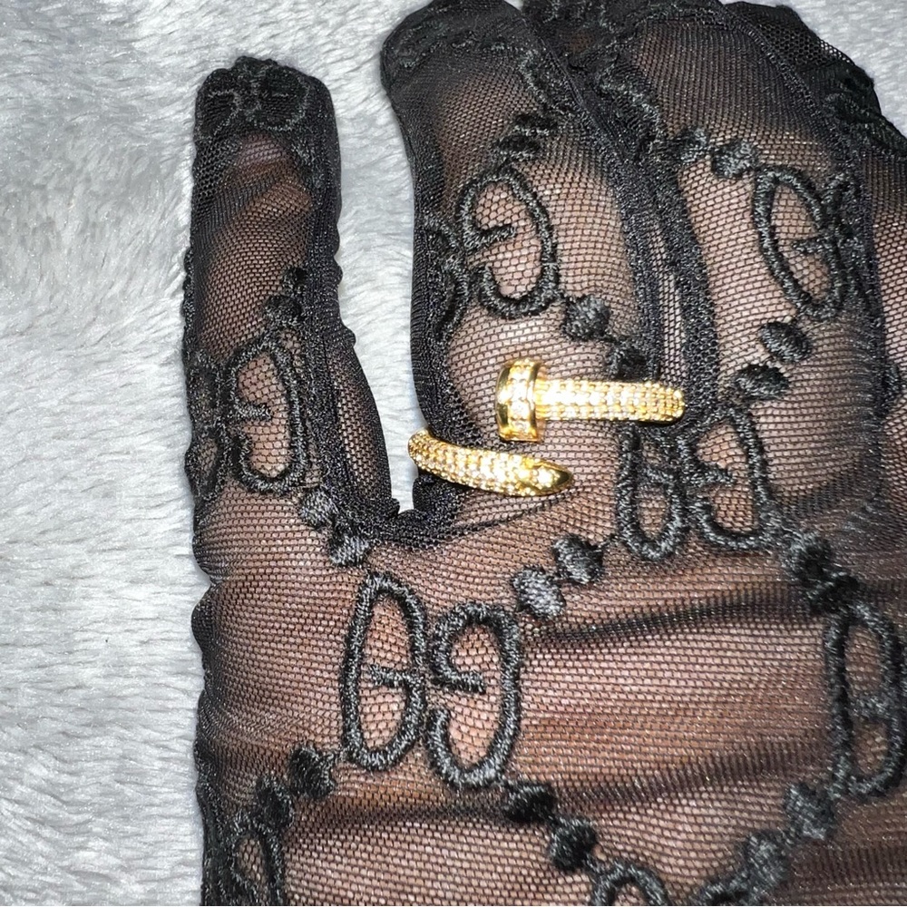 Adjustable Yellow Gold plated nail ring with cubic zirconia diamonds.